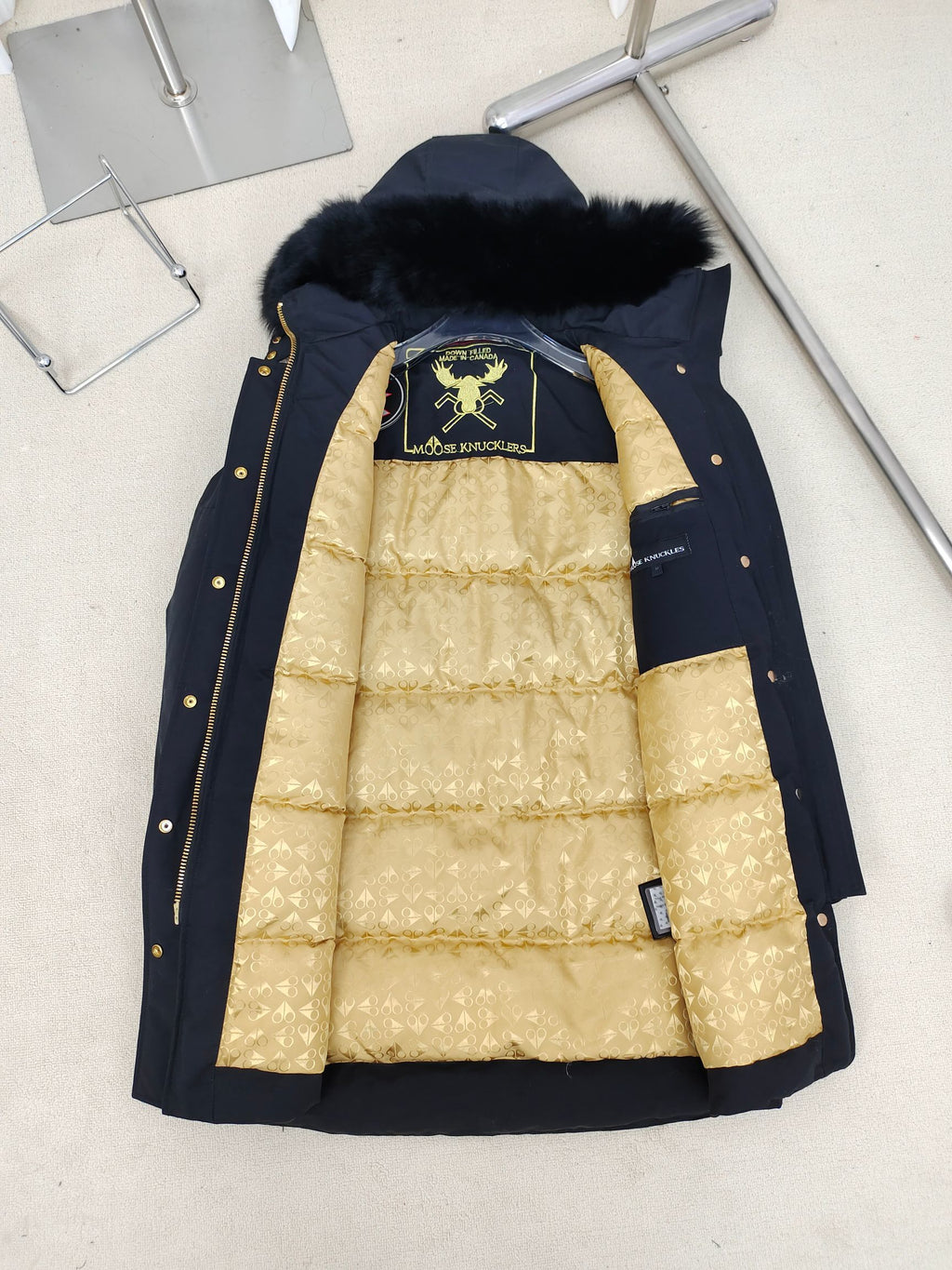 Moose Knuckles Women's Longline Hooded Parka with Pom-Pom Detail