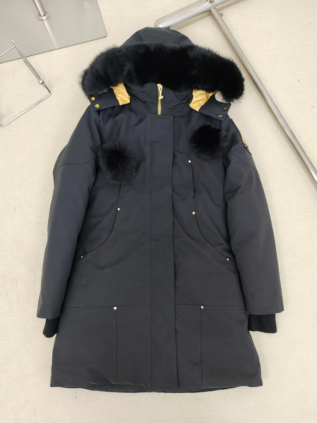 Moose Knuckles Women's Longline Hooded Parka with Pom-Pom Detail