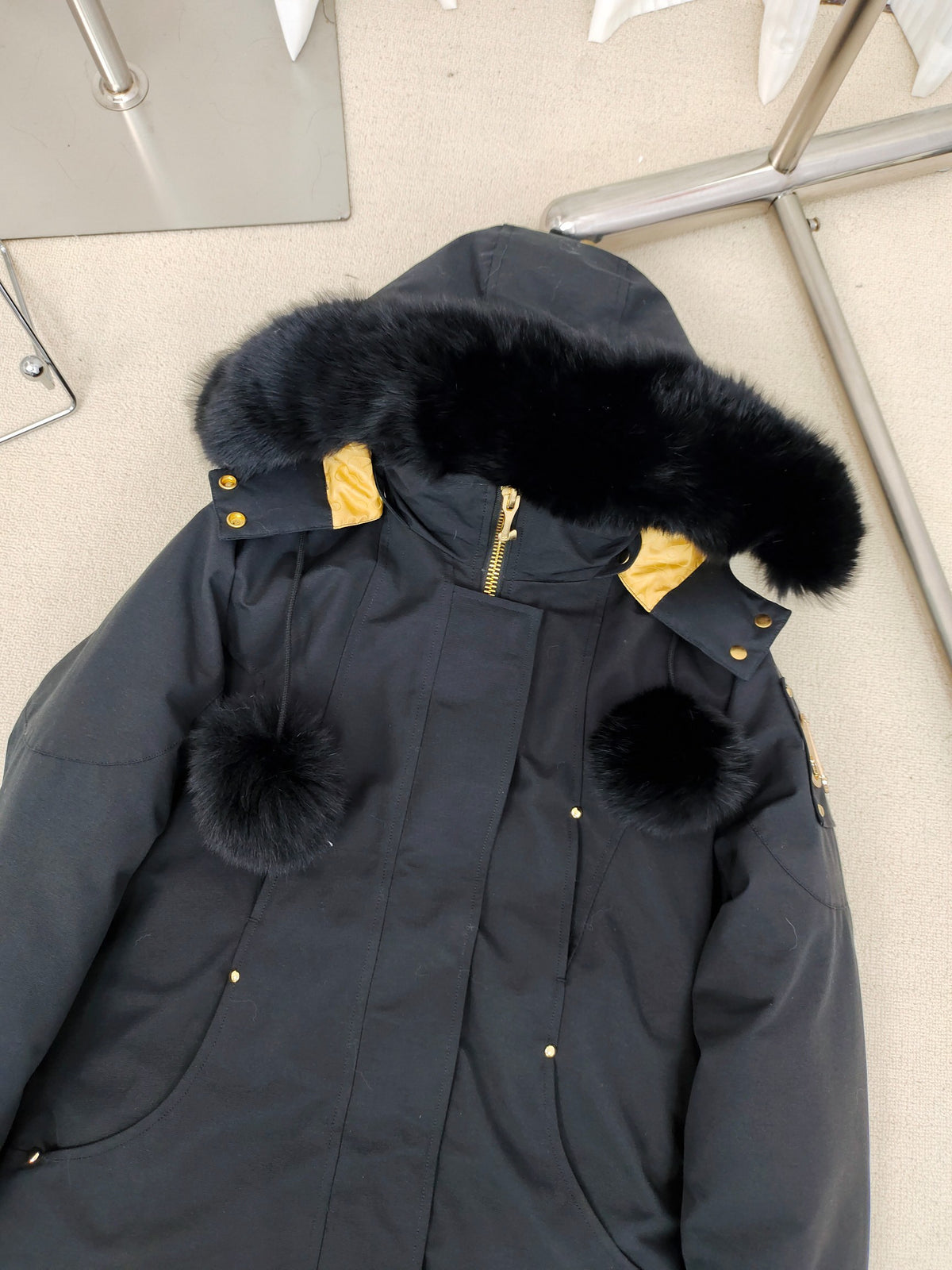 Moose Knuckles Women's Longline Hooded Parka with Pom-Pom Detail